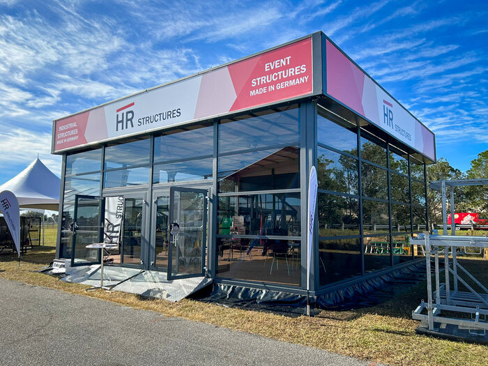Skyline event marquee from HR Structures with glass façade at an outdoor event