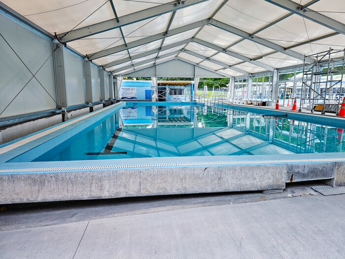 Pool enclosure for swimming pool complex