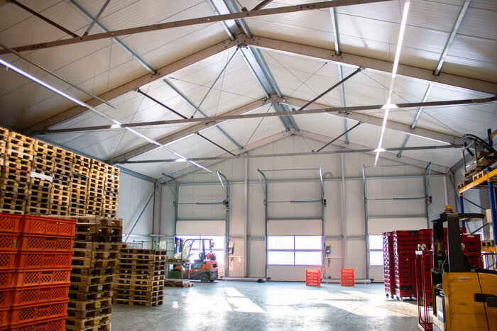 Interior view of a fully insulated warehouse with custom roof