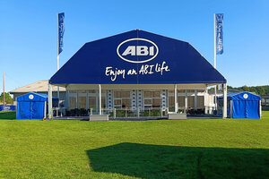 Polygon tent exterior view with advertising tarpaulin