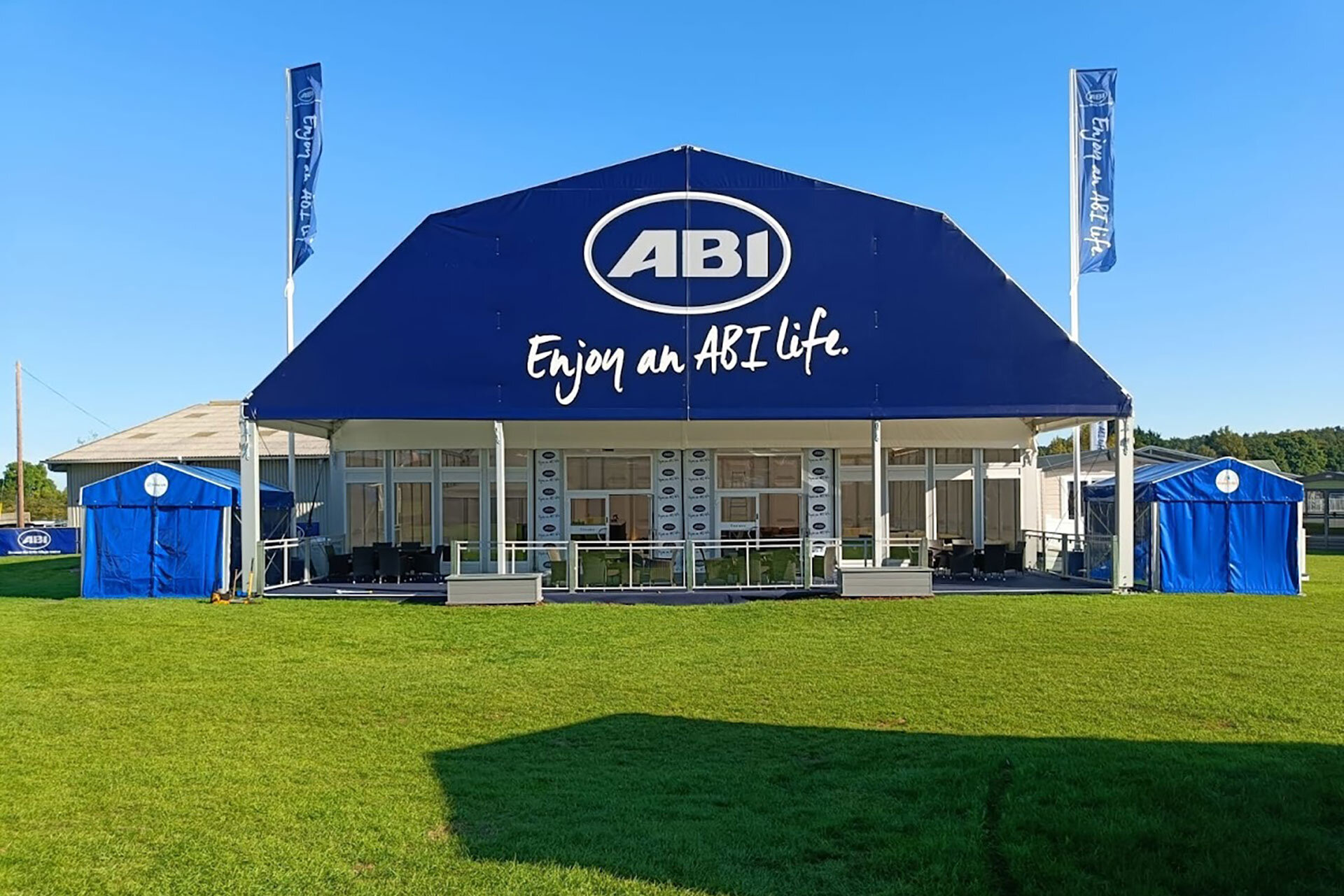 Polygon tent exterior view with advertising tarpaulin