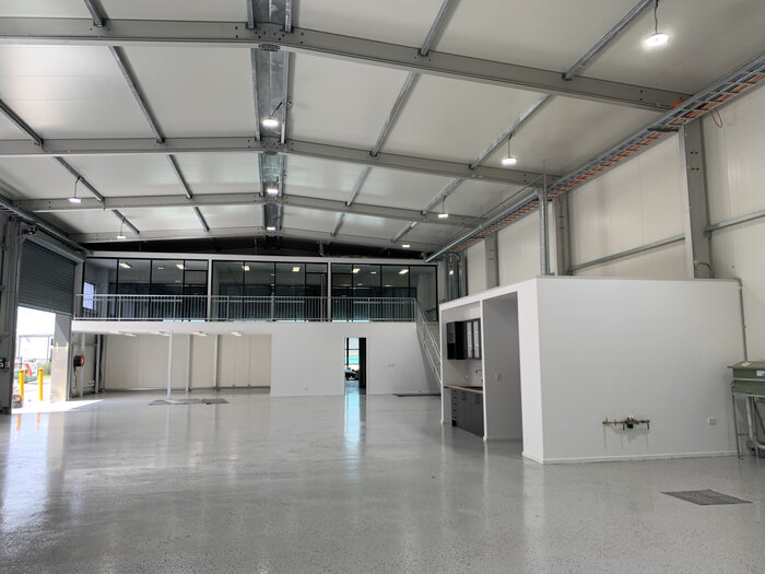 Modern warehouse with office unit on the upper floor and integrated kitchenette