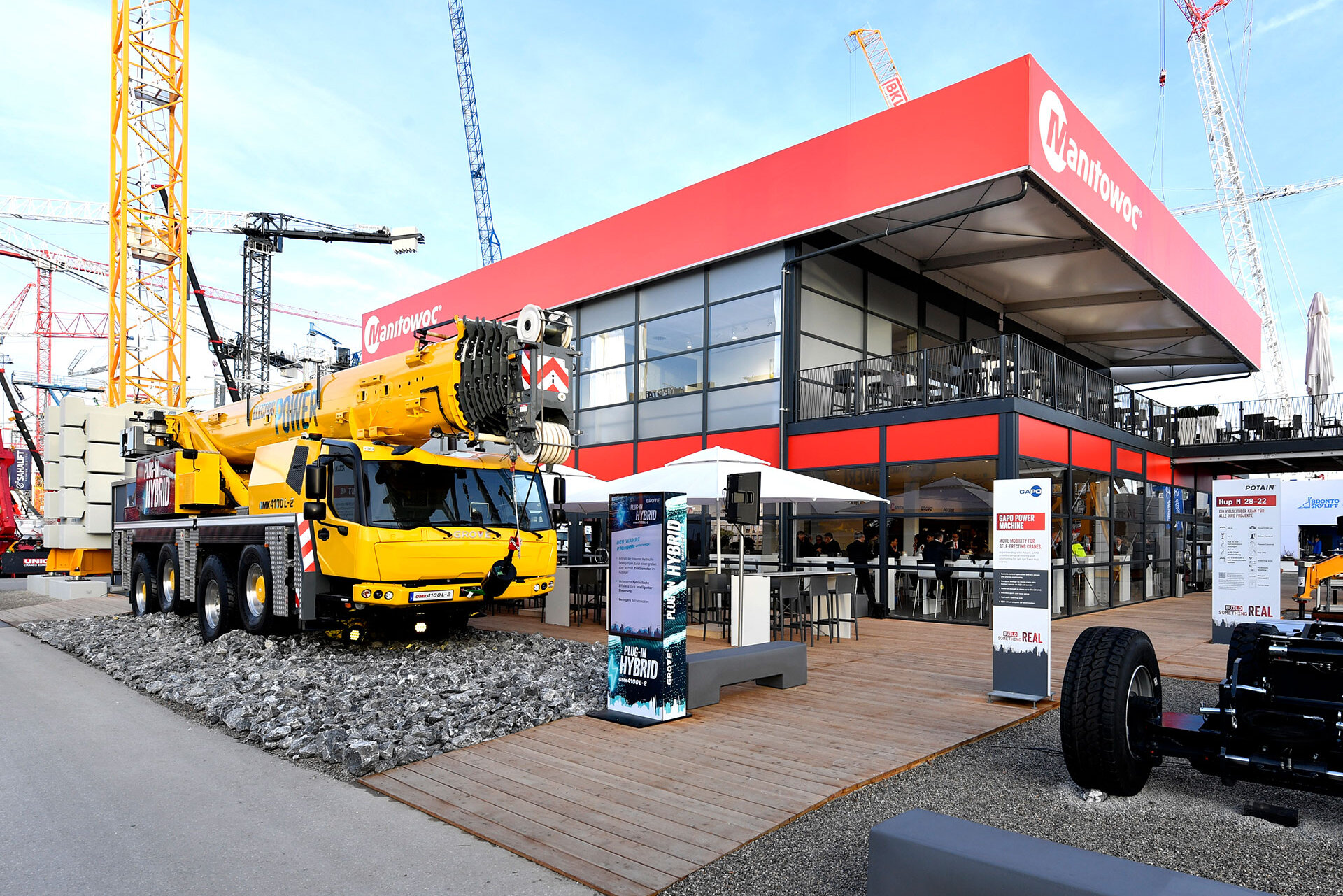 A Skyline tent with a mobile crane in front of it