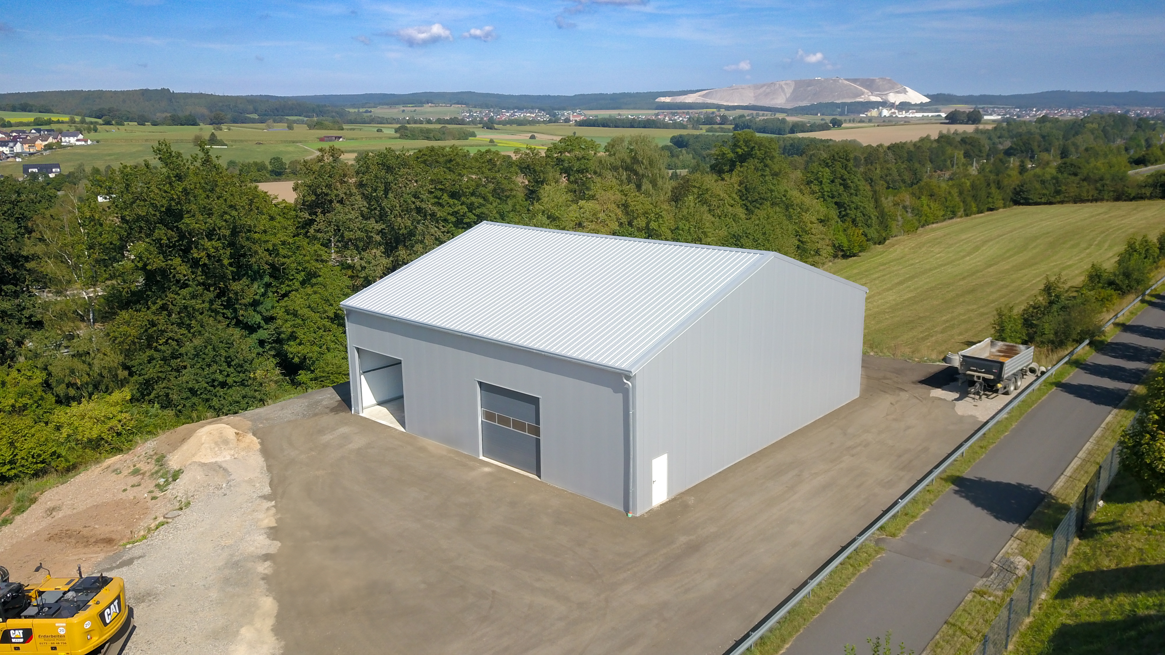 Industrial cargo hall in a rural setting