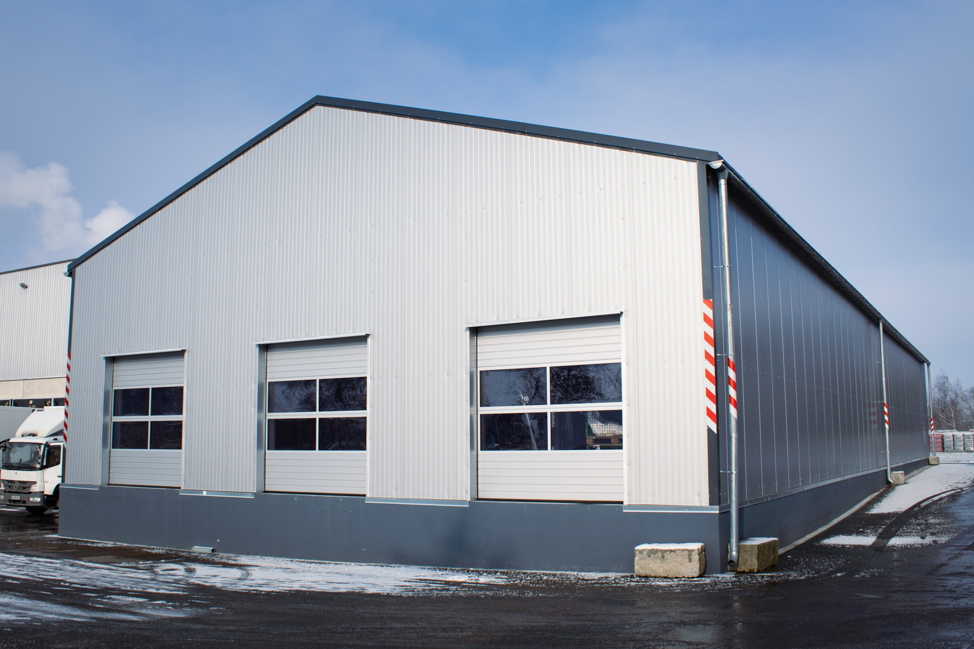 Exterior view insulated warehouse with sectional doors